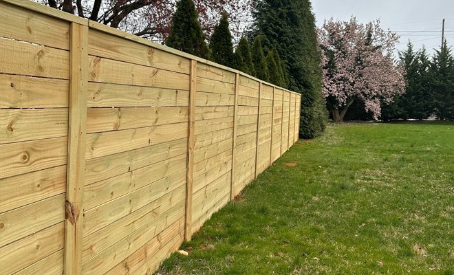Wood privacy fence with gate